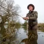 Fly Fisherman David Wood in the river at Cricklade, Cotswolds, UK.